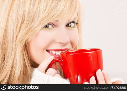 picture of happy teenage girl with red mug