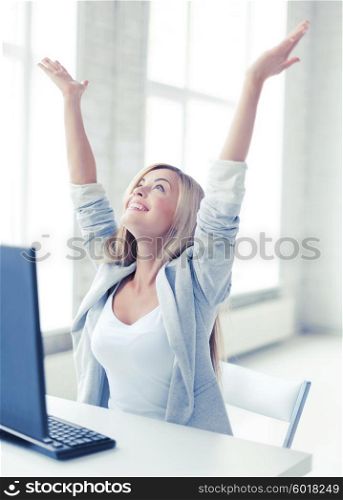 picture of happy woman celebrating her win. successful businesswoman in office