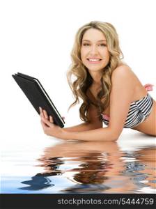 picture of happy woman in bikini with tablet pc computer