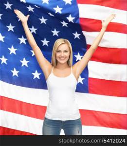 picture of happy woman in blank white t-shirt over american flag