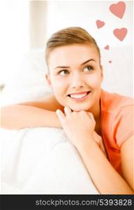 picture of happy woman in love dreaming at home
