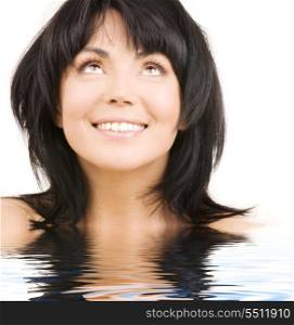 picture of happy woman looking up in water
