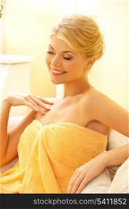picture of happy woman sitting in spa