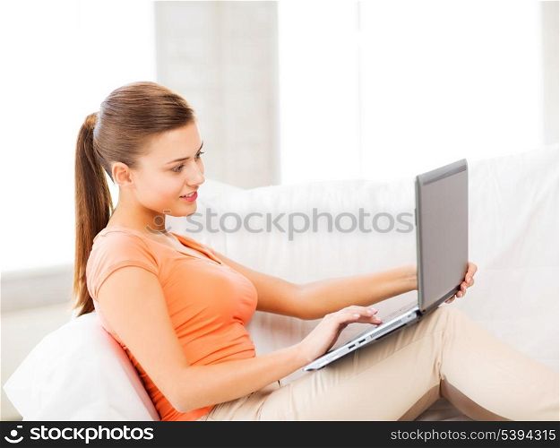 picture of happy woman using laptop at home