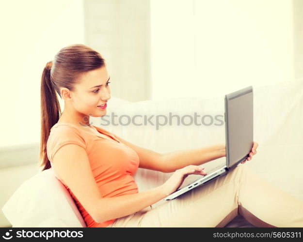 picture of happy woman using laptop at home