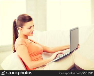 picture of happy woman using laptop at home