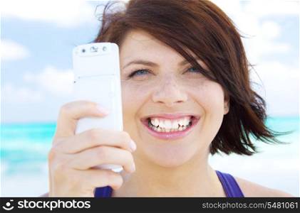 picture of happy woman using phone camera