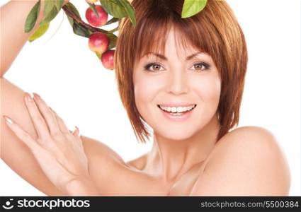 picture of happy woman with apple twig
