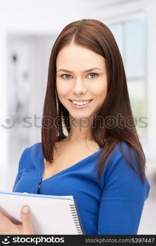 picture of happy woman with big notepad