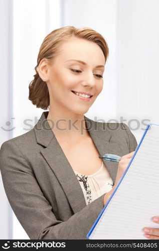 picture of happy woman with big notepad