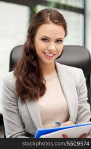 picture of happy woman with big notepad