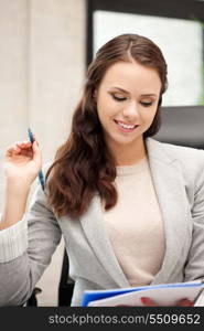 picture of happy woman with big notepad