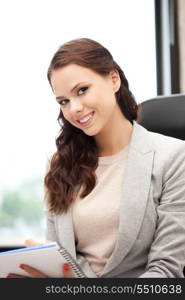 picture of happy woman with big notepad