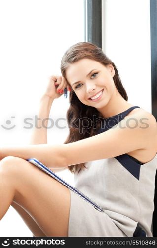 picture of happy woman with big notepad