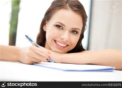 picture of happy woman with big notepad