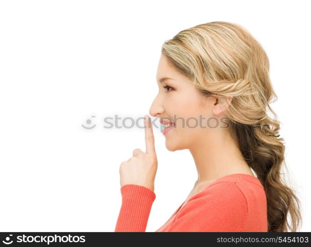 picture of happy woman with finger on lips