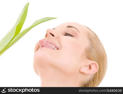 picture of happy woman with green leaf over white