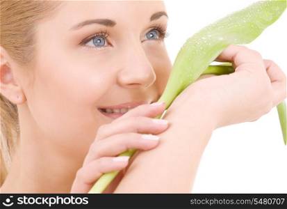 picture of happy woman with green leaf over white