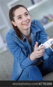 picture of happy woman with joystick playing video games