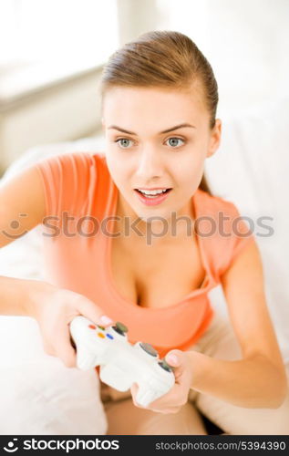 picture of happy woman with joystick playing video games