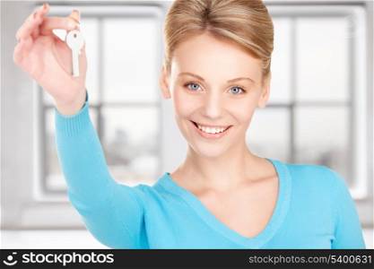 picture of happy woman with keys at home