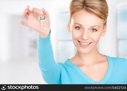 picture of happy woman with keys at home