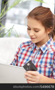 picture of happy woman with laptop computer and credit card