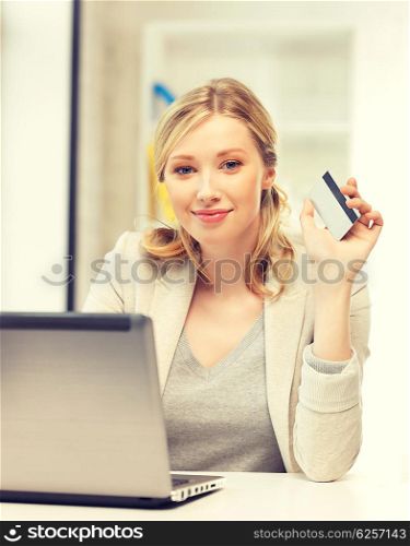 picture of happy woman with laptop computer and credit card.. happy woman with laptop computer and credit card