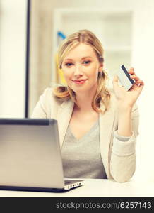 picture of happy woman with laptop computer and credit card.. happy woman with laptop computer and credit card