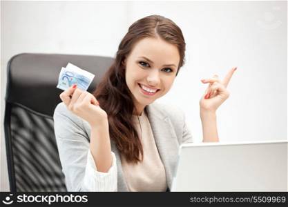 picture of happy woman with laptop computer and euro cash money