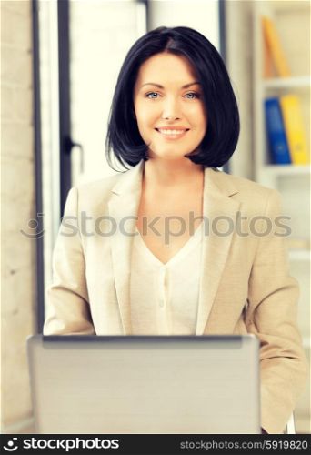 picture of happy woman with laptop computer. happy woman with laptop computer
