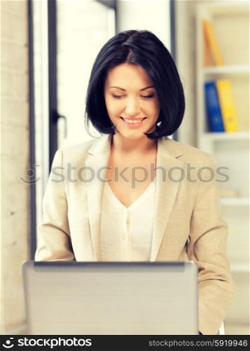 picture of happy woman with laptop computer. happy woman with laptop computer