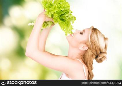 picture of happy woman with lettuce over green