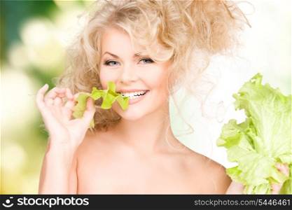 picture of happy woman with lettuce over green