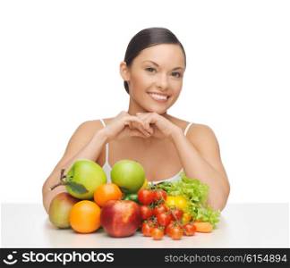 picture of happy woman with lot of fruits and vegetables. happy woman with lot of fruits and vegetables