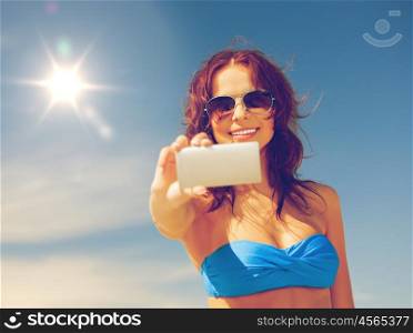picture of happy woman with phone on the beach.. happy woman with phone on the beach