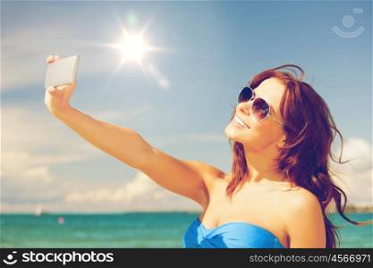 picture of happy woman with phone on the beach.. happy woman with phone on the beach