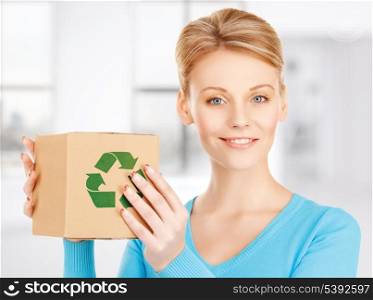 picture of happy woman with recyclable box