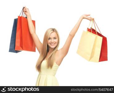picture of happy woman with shopping bags .