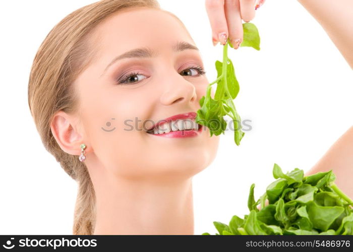 picture of happy woman with spinach over white