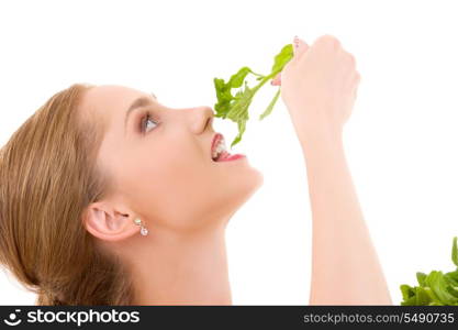 picture of happy woman with spinach over white