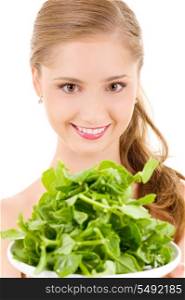 picture of happy woman with spinach over white