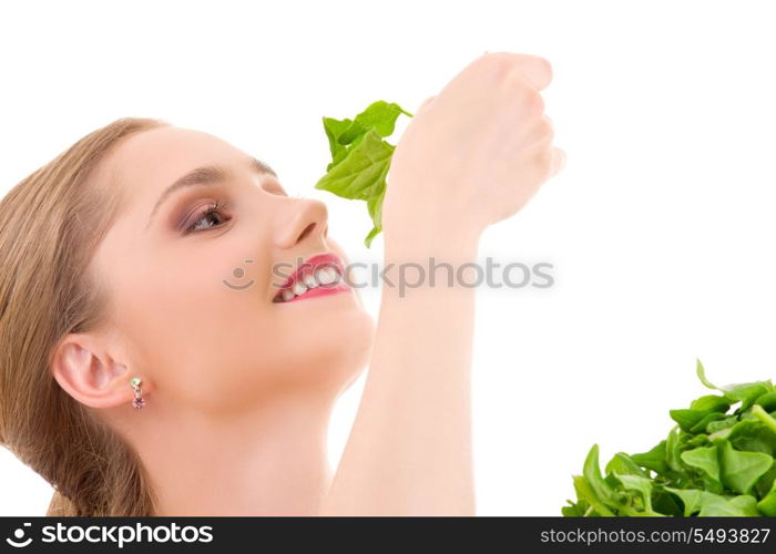 picture of happy woman with spinach over white