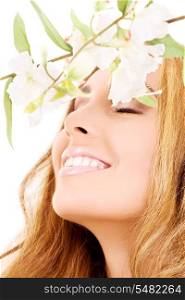 picture of happy woman with white flowers (focus on smile)