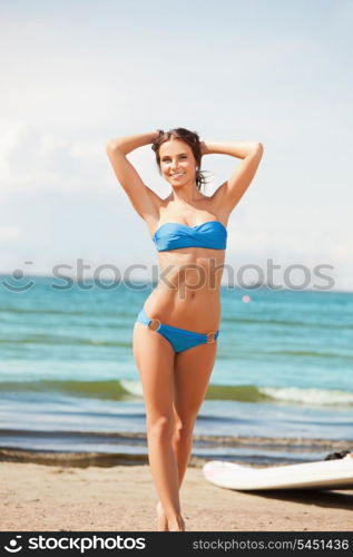 picture of happy woman with wind surf on the beach.