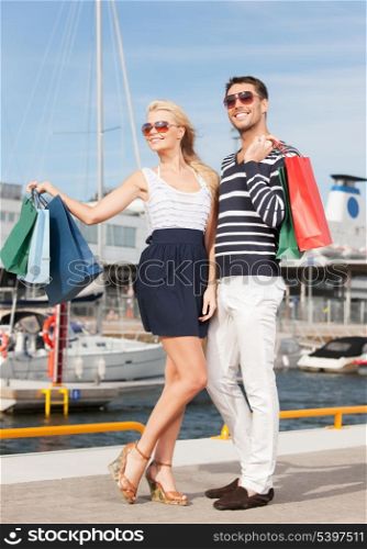 picture of happy young couple with shopping bags