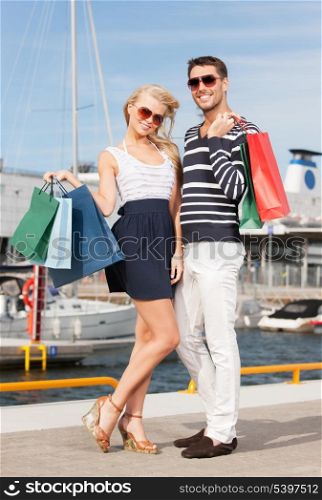 picture of happy young couple with shopping bags
