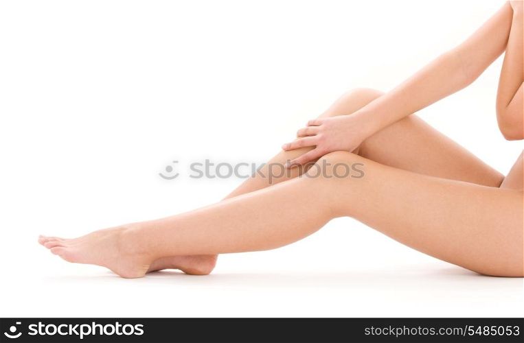 picture of healthy naked woman legs over white