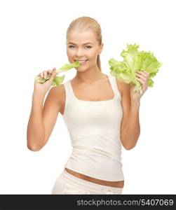 picture of healthy woman biting piece of lettuce