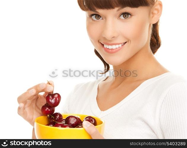 picture of healthy woman holding bowl with cherries
